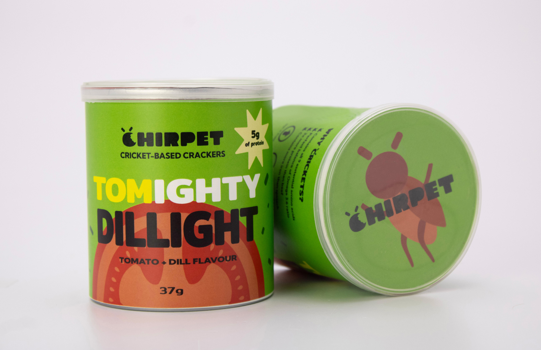 Front panel of the 'Tomighty Dillight' Chirpet snack can, alongside a snack can on its side showing the top of the can and its design.