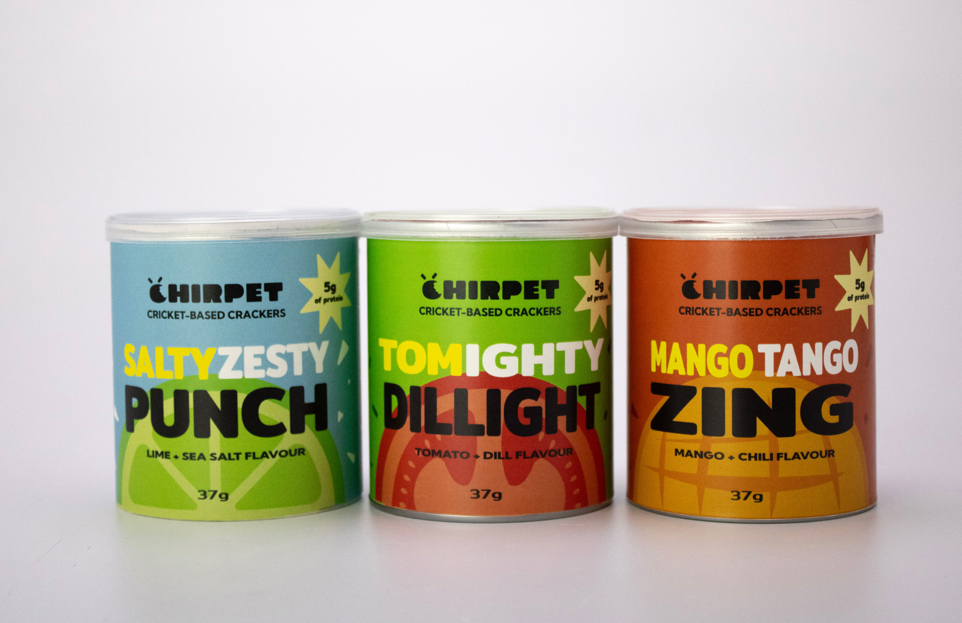 Three different flavors of Chirpet cricket protein snacks arranged in a row, showcasing the packaging design.