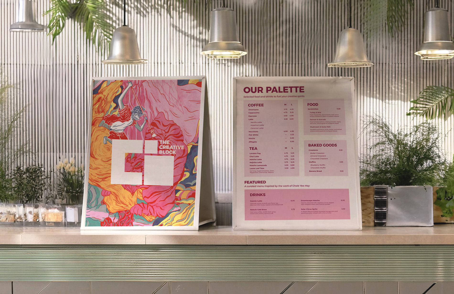 Image of an cafe interior with two menus showing the front and back designs. The left menu showcases artwork by Chloe Yee May with The Creative Block logo in the centre, the right menu showcases the menu items, with a featured drink menu at the bottom inspired by the artist's work.